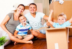 Family unpacking in their new home